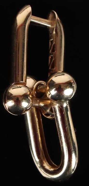 18K TIFFANY SINGLE EARRING JOINED U-SHAPED LOOPS: 18k Tiffany & Co. single earring made from two u-shaped pieces. The other earring is missing. Use this as a replacement piece or as a pendant.Weight: 4.87Size: 34 mm longCondition: See pictures.