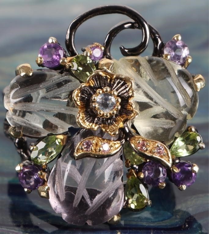 STERLING SILVER LADIES RING W/ SPINEL IOLITE ETC: Sterling silver black-and-gold-toned ladies ring in a floral Art Nouveau style with tourmaline, iolite, and spinel gemstones.Stone Type: SpinelWeight: 16.08 gramsSize: US 8.75Condition: See pictures.