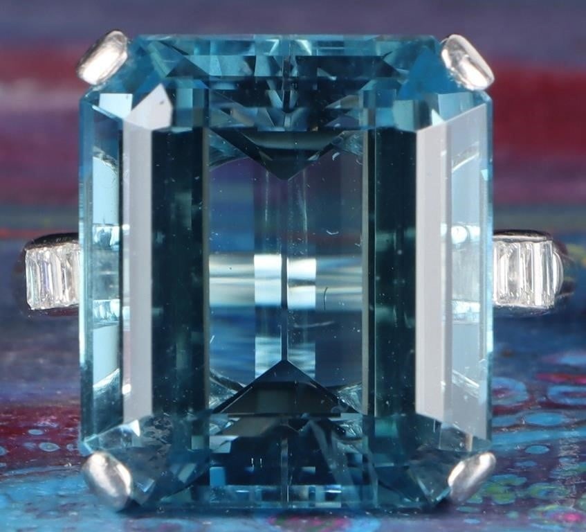 14K WHITE GOLD AQUA DIAMOND LADIES RING: 14K white gold aqua diamond ladies ring. Gemstones to include one 18.10mm X 15.83mm emerald cut aqua and ten 0.02ct baguette cut diamonds.Stone Type: AssortedWeight: 12.00 GramsSize: 9.00 U.S.Conditio