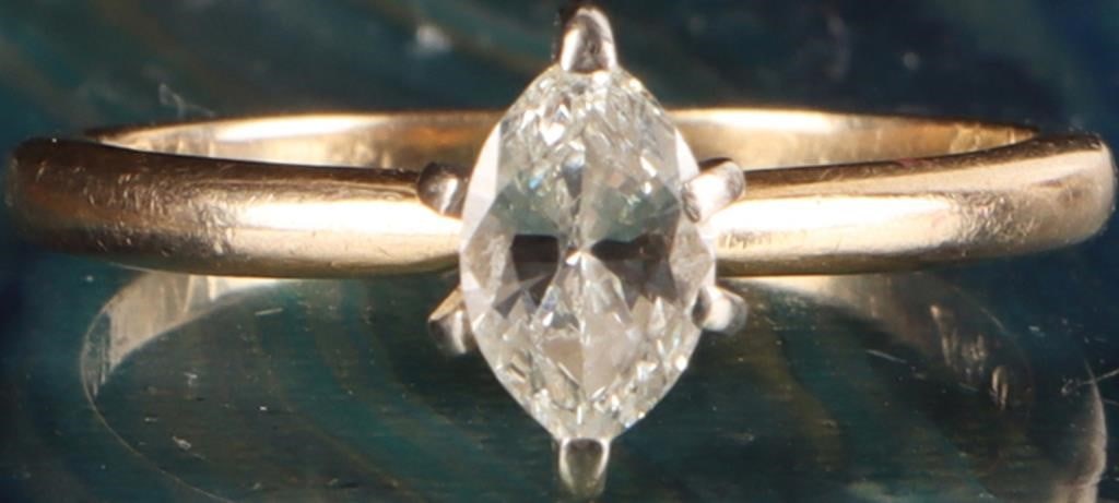 14K YELLOW GOLD NATURAL DIAMOND LADIES RING: 14K yellow gold natural diamond ladies ring. Gemstones to include one 0.40ct marquise cut natural diamond. Diamonds tested natural via Gemlogis short wave UV fluorescence.Stone Type: DiamondWeight: 1.