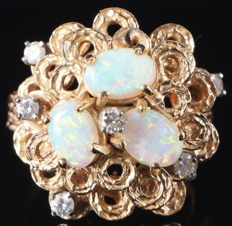 14K YELLOW GOLD LADIES RING W/ DIAMONDS & OPAL: Elaborately decorated 14k yellow gold ladies ring. The band is textured with shallow bevels and the face features multiple layers of small rings. Three radiant opals cluster toward the top of this pil