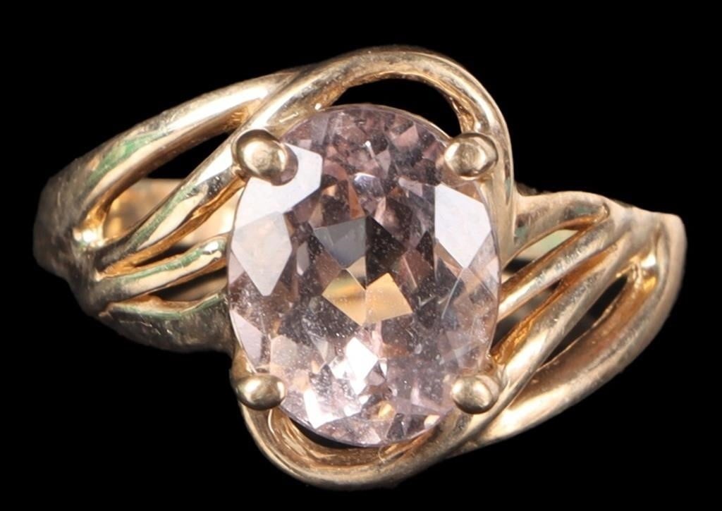 ~1.5CT OVAL MORGANITE 10K LADIES SOLITAIRE RING: ~1.5CT oval morganite 10K ladies solitaire ring. The band features a distinctive bypass or wrap around design that cradles the center stone.Stone Type: MorganiteWeight: 3.56 GramsSize: US 7.0Condition