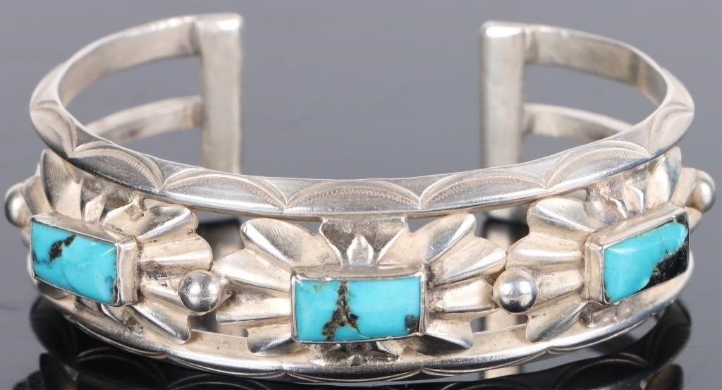 STERLING SILVER CARVED TURQUOISE LADIES BANGLE: Sterling silver carved turquoise ladies bangle to include 3 rectangular cabochon turquoise with flowering insets.Stone Type: TurquoiseWeight: 41.56 GramsSize: 6.00"Condition: Little to no wear, see im