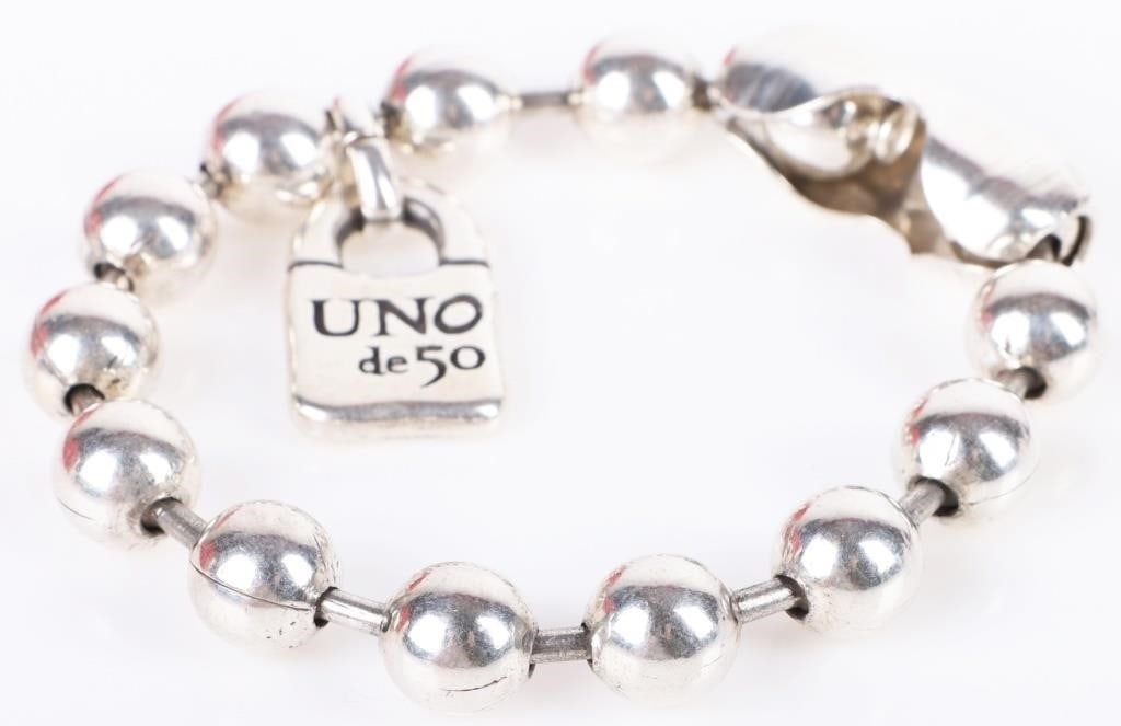 UNO DE 50 STERLING SILVER DESIGNER BEADED BRACELET: Uno de 50 sterling silver designer ladies beaded bracelet. Bracelet comes with original bags and papers.Weight: 41.72 GramsSize: 6.5" LengthCondition: Very fine.