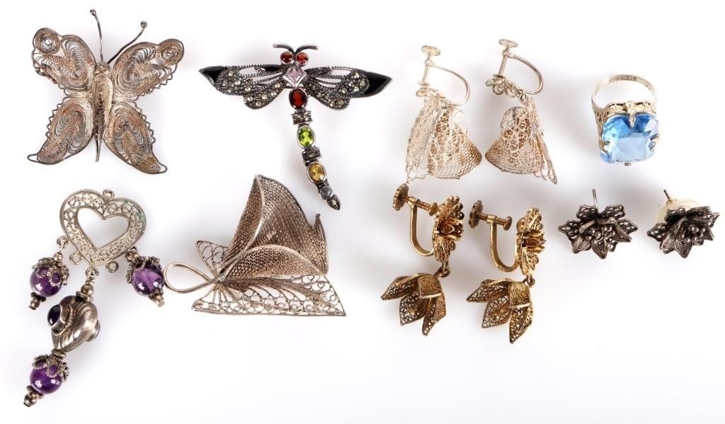 STERLING SILVER ORNATE FILIGREE LADIES JEWELRY-(8): Sterling silver ornate filigree ladies jewelry to include: a flower brooch with matching earrings, one pair of 5 lobed flower earrings, one blue gem ring, one pair of golden colored flower earrings, o