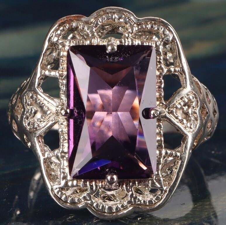 VINTAGE ART DECO 3CT EMERALD CUT AMETHYST RING: Vintage Art Deco 3CT sterling silver emerald cut amethyst ladies ring. The large amethyst is in a beautiful filigree setting. The intricate filigree metalwork includes delicate patterns giving the rin