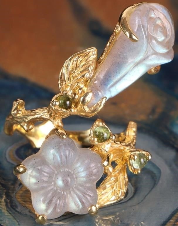 WHITE CARVED LABRADORITE STERLING SILVER RING: White carved floral labradorite sterling silver gold-tone ladies ring with small peridot gemstones.Stone Type: AssortedWeight: 8.62 gramsSize: US 8Condition: New.