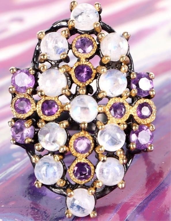 BLACK-TONED STERLING SILVER LADIES RING W/ IOLITE: Black-toned sterling silver ladies ring with smoky white stones and iolite gemstones arranged in a diamond shape.Stone Type: IoliteWeight: 8.54 gramsSize: US 7.5Condition: See pictures.