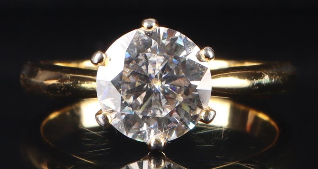 STERLING SILVER GOLD TONED MOISSANITE LADIES RING: Sterling silver gold toned moissanite ladies ring. Gemstones to include one 2.00ct round cut moissanite.Stone Type: MoissaniteWeight: 2.50 GramsSize: 7.25 U.S.Condition: Little to no wear, see images