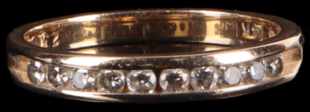 14K YELLOW GOLD LADIES RING W/ DIAMONDS & HALLMRK: 14k yellow gold ladies ring with ten 0.02ct round-cut diamonds lined along the face and a hallmark on the interior band which reads 'Love Story'.Stone Type: DiamondWeight: 2.21 gramsSize: US 6.5Condit