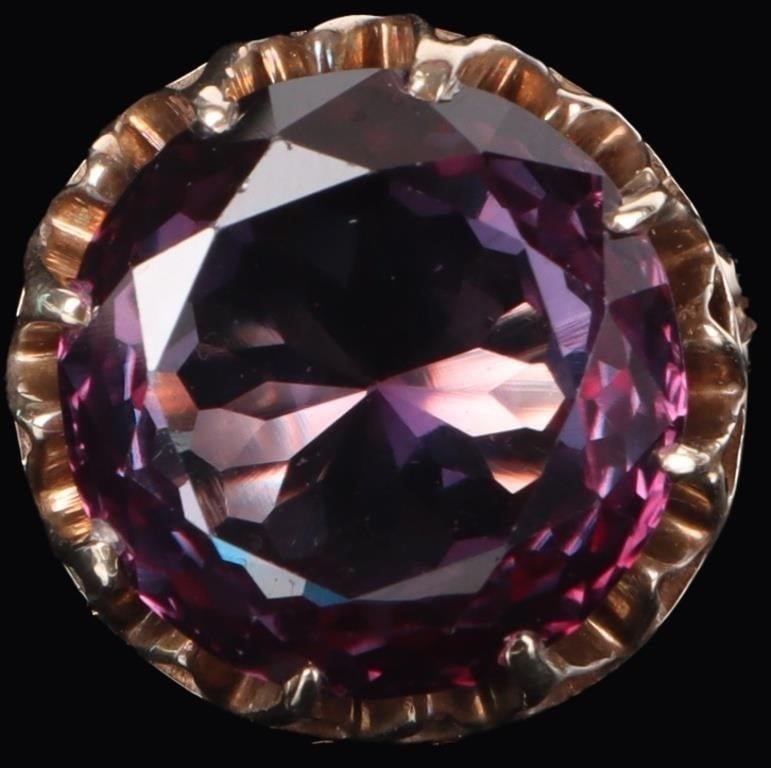 HUGE 20.5CT SAPPHIRE 14K YELLOW GOLD LADIES RING: 14k yellow gold ladies ring with a massive 20.5ct round-cut bicolor synthetic sapphire center stone.Stone Type: SapphireWeight: 9.34 gramsSize: US 6.75Condition: Minor crack on the bottom of the band,