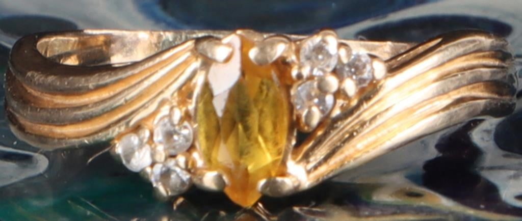 14K YELLOW GOLD MENS RING W/ YELLOW SAPPHIRE: 14k yellow gold mens ring with a 0.4ct marquise-cut heat-treated yellow sapphire center stone surrounded by two clusters of three cubic zirconium accessory stones.Stone Type: SapphireWeight: 3.98 gram