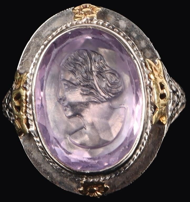 FILIGREE CAMEO 14K WHITE GOLD LADIES RING W SPINEL: 14k white gold ladies ring with filigree decoration along the shoulders and yellow gold rosettes around the face. The face features a large (15.25 x 12mm) purple spinel gemstone on which a cameo profi