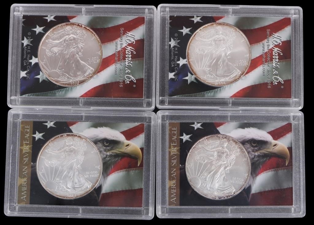 2008 FINE SILVER AMERICAN EAGLES H.E. HARRIS - (4): 2008 fine silver American Eagles H.E. Harris & Co. collection.Weight: 124.404 GramsCondition: Mint State Uncirculated. Some signs of oxidation around coin edges.
