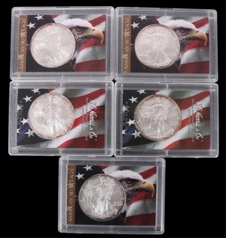 2008 FINE SILVER AMERICAN EAGLES H.E. HARRIS - (5): 2008 fine silver American Eagles H.E. Harris & Co. collection.Weight: 155.505 GramsCondition: Mint State Uncirculated. Some signs of oxidation around coin edges.