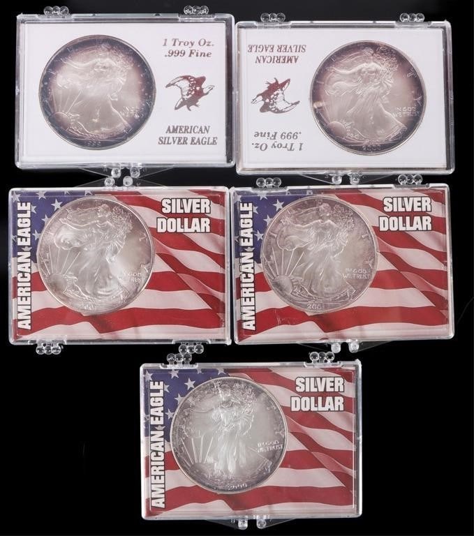 ASSORTED FINE SILVER AMERICAN EAGLES RT - (5): Assorted fine silver American Eagles rainbow toned.Weight: 155.52 GramsCondition: Mint State uncirculated with rainbow tone.