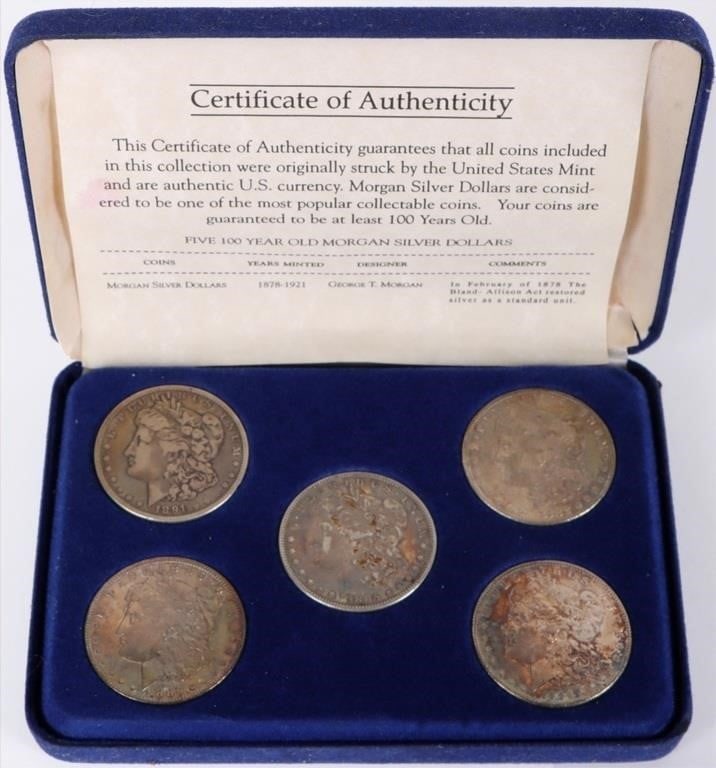ASSORTED 90% U.S. MORGAN DOLLARS W/ COA - (5): Assorted 90% U.S. Morgan Dollars w/ COA to include one 1882, 1884, 1885, 1886, and 1891 P Morgan Dollars set in a presentation box.Weight: 133.65 GramsCondition: Ranges from Good to Extremely Fine.