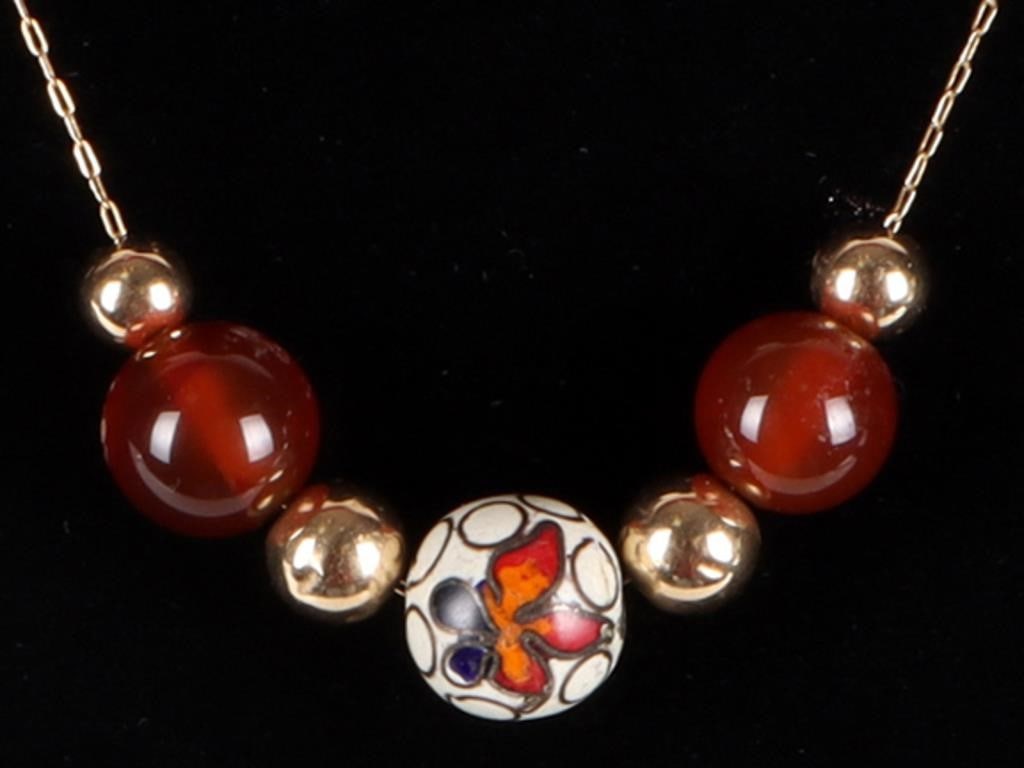 14K YELLOW GOLD LADIES NECKLACE W/ GLASS BEADS: 14k yellow gold ladies chain necklace with four gold beads, two amber-colored glass beads, a nd a center bead with a floral pattern painted on its surface.Weight: 1.22 g gold weight, 4.07 g totalSize: