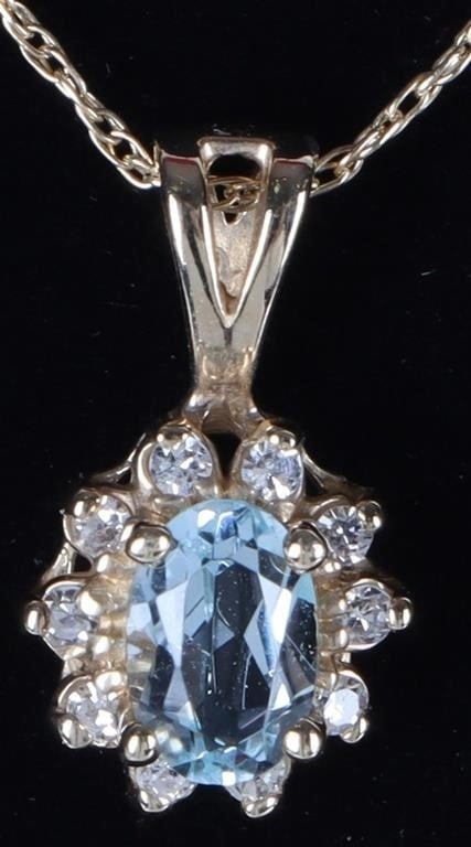 14K YELLOW GOLD LADIES NECKLACE W/ AQUA & DIAS: 14k yellow gold ladies necklace with a pendant featuring a 0.5ct oval-cut aquamarine center stone surrounded by ten 0.01ct round-cut diamonds.Stone Type: Diamonds & AquamarineWeight: 1.68 gramsSize:
