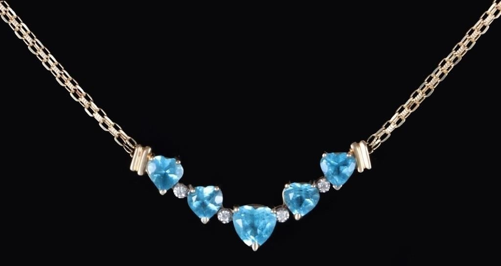 14K YELLOW GOLD LADIES NECKLACE W/ TOPAZ & DIAS: 14k yellow gold ladies necklace with a pendant that features a 0.5ct heart-cut topaz gemstone flanked by four 0.33ct heart-cut topaz gemstones (two on either side) with four small diamonds in between