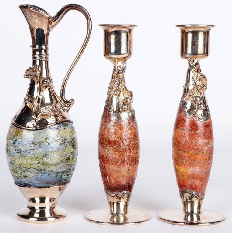 KING SOLOMON STERLING & ART GLASSWARE- (3): King Solomon sterling silver and hand-blown glass ware Israeli pitcher and matching candle holders.Weight: 354.4 GramsSize: 8.75" LargestCondition: Gently used. See images for complete condition.