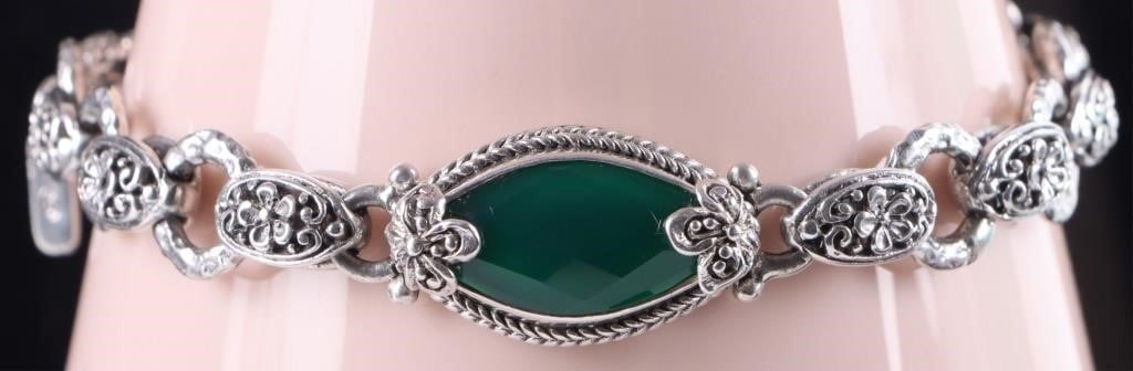 SARDA FANTASTICAL STERLING SILVER LADIES BRACELET: Sterling silver ladies bracelet molded in a fantastical style. The band features brackets with rosettes on their front, the clasp is completely covered in rosettes and vining motifs, and the face feat