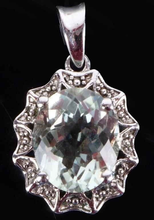 STERLING SILVER OVAL ROSE AQUA LADIES PENDANT: Sterling silver oval rose aqua ladies pendant to include one 3.00ct oval rose cut aquamarine.Stone Type: AquamarineWeight: 3.63 GramsSize: 1.00"Condition: Little to no blemishes, see images.