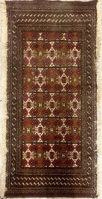 ORNATE PERSIAN DEEP RED SILK ANTIQUE DOOR RUG: Ornate Persian deep red silk antique door rug. This small rug measures 39 X 19.5" rug features traditional Persian motifs.Size: 39 X 19.5"Condition: Wear commensurate with age. Needs professional