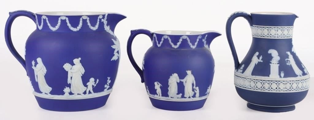 DARK BLUE WEDGEWOOD JASPERWARE PITCHERS: Dark blue Wedgewood jasperware pitchers. Lot of 3. All pitchers are made in England with intricate detail.Size: 6.0" LargestCondition: No chips, cracks or signs of repair. See images for complete cond