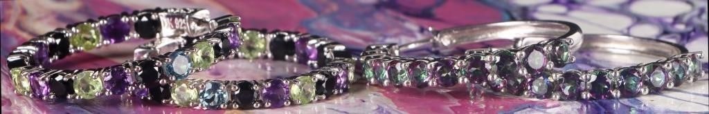 STERLING SILVER LADIES EARRINGS MYSTIC TOPAZ (2): Lot of two pairs of sterling silver ladies hoop earrings. One pair features eleven 0.25ct round-cut mystic topaz gemstones along the length of each piece and the other pair features seventeen 0.25 rou