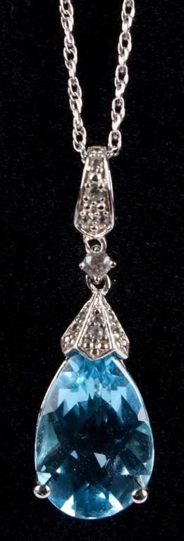 STERLING SILVER BLUE & WHITE TOPAZ LADIES NECKLACE: Sterling silver blue & white topaz ladies necklace. Gemstones to include one 3.00ct pear cut blue topaz, one 0.03ct round cut topaz, and ten 0.01ct round cut topaz per each earring.Stone Type: TopazWe