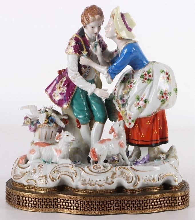 ANTIQUE PORCELAIN VICTORIAN COUPLE FIGURINE: Antique porcelain Victorian couples with flowers, lambs and doves figurine. Beautifully painted with great detail.Size: 8" X 7"Condition: No cracks, chips or signs of repair. See images for complete c
