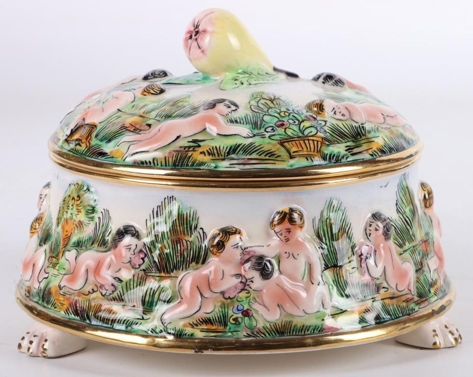 VINTAGE CAPODIMONTE CHERUB TRINKET BOX WITH LID: Vintage Capodimonte porcelain hand painted cherub footed trinket box with lid made in Italy. This trinket box has beautiful details showing the various cherub scenes. The lid is adorned with a pear fo