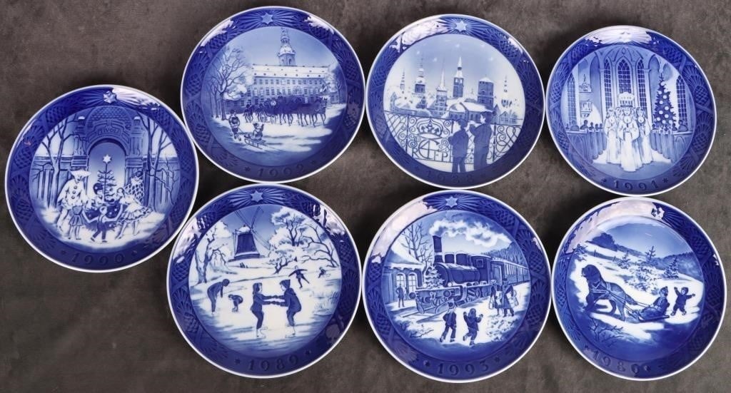 ROYAL COPENHAGEN HOLIDAY COLLECTION PLATES - (7): Royal Copenhagen Holiday collection plates to include: one "Juleferie Christmas Holidays" plate, one "Christmas Guests" plate, one "Festival of Santa Lucia" plate, one "The Old Skating Pond" plate, on