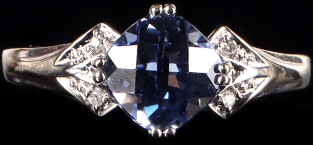 10K WHITE GOLD BLUE SAPPHIRE DIAMOND LADIES RING: 10K white gold blue sapphire diamond ladies ring. Gemstones to include one 1.50ct rose cushion cut blue sapphire, four 0.01ct round cut diamonds.Stone Type: AssortedWeight: 2.30 GramsSize: 6.75 U.S.Co