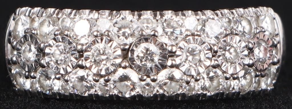 SHINY 10K WHITE GOLD LADIES RING W/ 39 DIAMONDS: Shiny 10k white gold ladies ring with thirty-nine round-cut diamonds (sixteen 0.03ct diamonds, seven 0.02ct diamonds, and sixteen 0.03ct diamonds)Stone Type: DiamondWeight: 3.51 gramsSize: US 7.25Cond