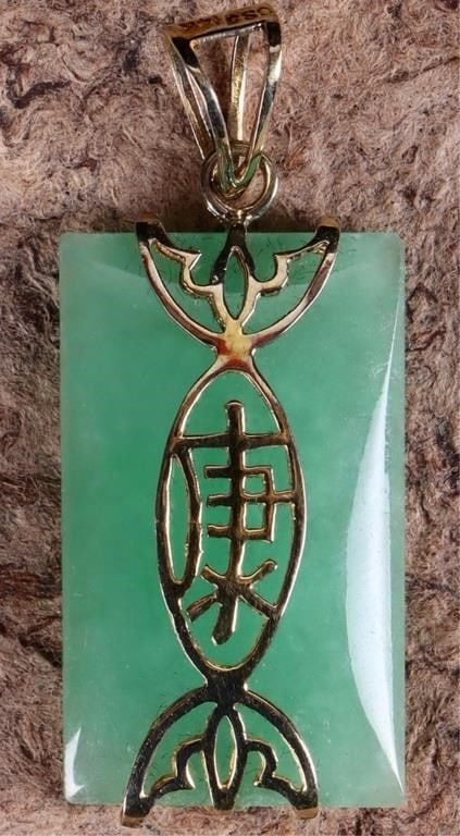 14K YELLOW GOLD GREEN JADE CHINESE PENDANT: 14K yellow gold green jade Chinese pendant. Gemstones to include one 25.00mm X 15.00mm rectangular cabochon jade.Stone Type: JadeWeight: 3.70 GramsSize: 1.375"Condition: Little to no wear, see images