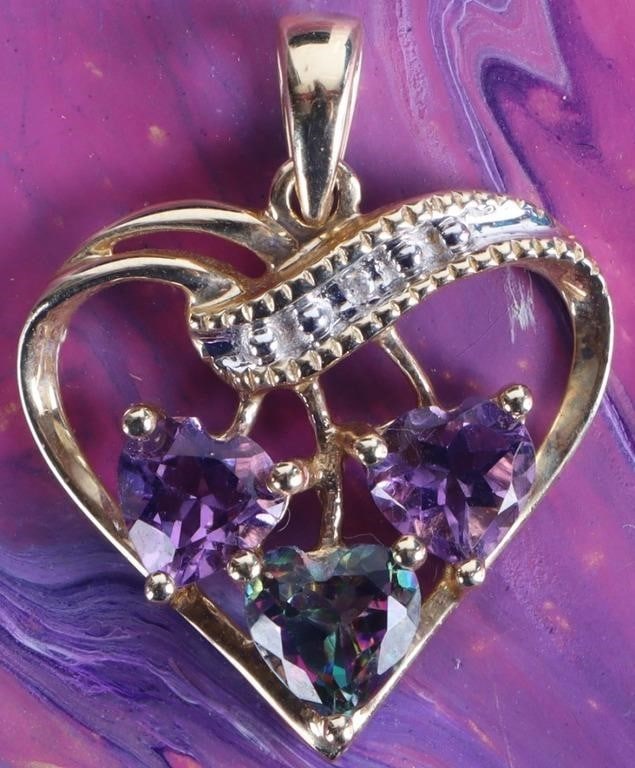 10K GOLD MYSTIC TOPAZ AMETHYST DIAMOND PENDANT: 10K yellow gold mystic topaz diamond ladies ring. Gemstones to include one 0.50ct heart cut mystic topaz, two 0.50ct heart cut amethyst, and one 0.005ct round cut diamond.Stone Type: AssortedSize: 0.8