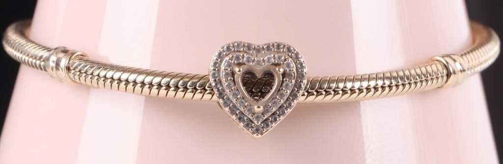 PANDORA 14K YELLOW GOLD SNAKE CHAIN CZ BRACELET: Pandora 14K yellow gold snake chain heart clasp CZ ladies bracelet. Stone Type: CZ Weight: 25.54 Grams Size: 7.50" Condition: One heart cut CZ missing. See images for details.