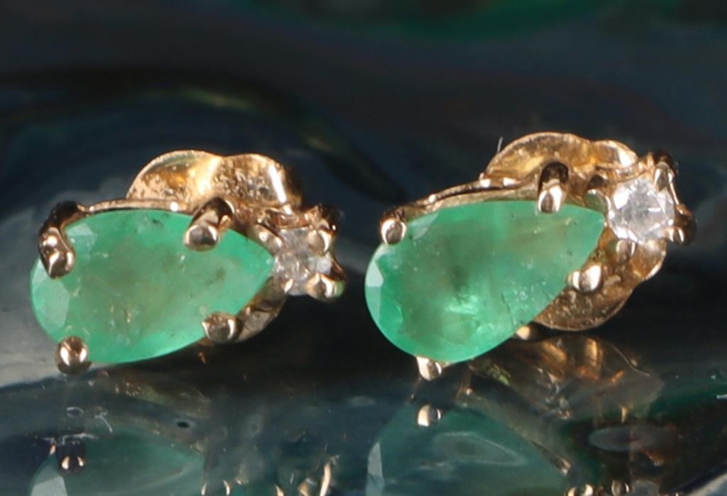 14K YELLOW GOLD LADIES STUD EARRINGS W/ EMER & DIA: 14k yellow gold ladies stud earrings, each of which feature a 0.15ct pear-cut emerald gemstone and a melee diamond. Stone Type: Diamond & Emerald Size: 6.75 x 3.33 mm Condition: See pictures.