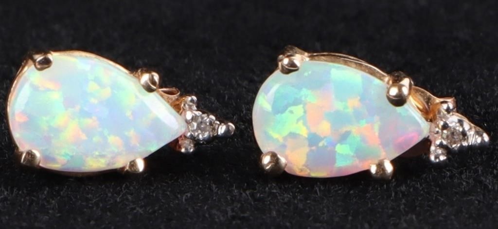 10K YELLOW GOLD OPAL DIAMOND LADIES EARRINGS: 10K yellow gold opal diamond ladies earrings. Gemstones to include one 8mm X 5mm tear drop cabochon opal and one 0.005ct round cut diamond.Stone Type: AssortedSize: 0.375"Condition: Little to no wear,