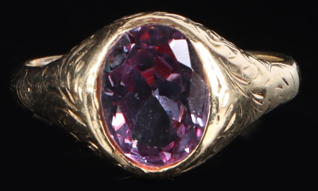 3CT BICOLOR SAPPHIRE 14K YELLOW GOLD LADIES RING: 14k yellow gold ladies ring with a 3ct oval-cut bicolor heat-treated sapphire center gemstone. The surface of the ring is covered in finely etched Baroque flourishes. Stone Type: Sapphire Weight: 4.95