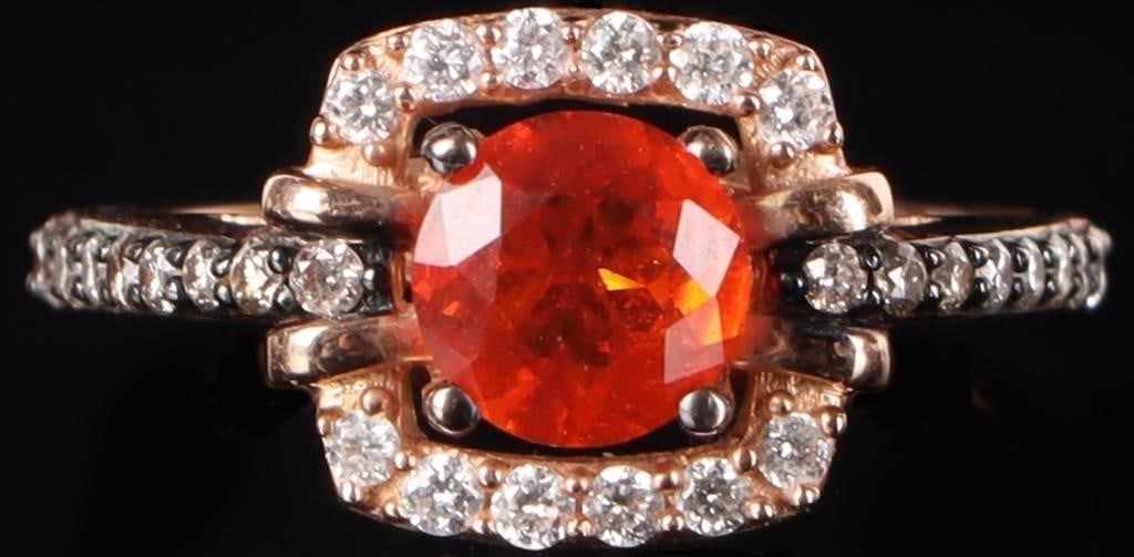 TOURMALINE & DIAMOND 14K GOLD RING: Tourmaline & Diamond 14 karat yellow gold ring. To feature fiery orange tourmaline, celebrated for its exceptional clarity and radiant glow. ??ramed by a halo of diamonds and accented with diamonds al