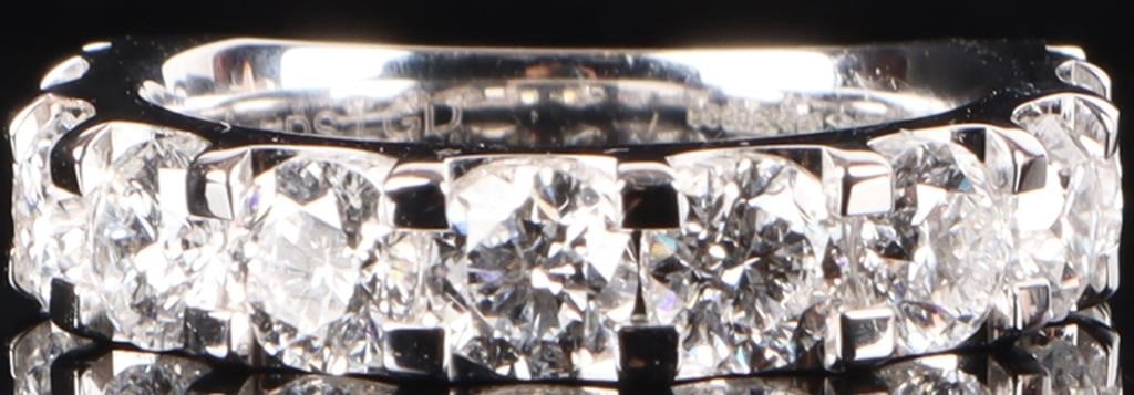 3.0CTW VVS1 LAB DIAMOND 14K WHITE GOLD LADIES RING: 3.0ctw VVS1 D color lab diamond ladies ring with nine .33ct diamonds. This beautiful piece is brand new with a retail value of $5,099.00. Stone Type: Diamond Weight: 6.8 Grams Size: 7.0 US Condition: 