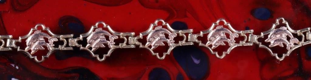 14K YELLOW GOLD LADIES BRACELET W/ ROSE DOLPHINS: 14k yellow gold ladies bracelet with rose gold dolphins on the brackets. Weight: 6.74 grams Size: 7.5" long Condition: See pictures.