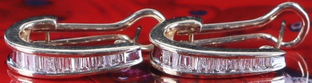 10K YELLOW GOLD LADIES EARRINGS W/ DIAMONDS: 10k yellow gold ladies earrings with fourteen melee diamonds on each piece. Stone Type: Diamond Weight: 4.11 Grams Size: 22 X 12 X 5 mm Condition: See pictures.
