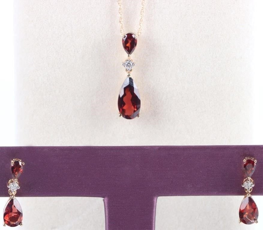 10K YELLOW GOLD NECKLACE & EARRING SET W/ DIAMOND: 10k yellow gold ladies necklace & earring set. Each includes a unit of gems with a melee diamond in between two pear-cut garnet gemstones. Stone Type: Diamond Weight: 3.75 grams Size: 18" long chain, 