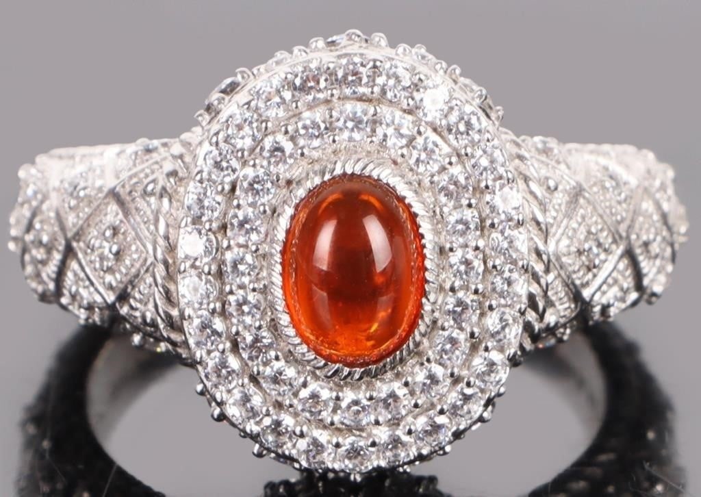 ORNATE STERLING SILVER CUBIC ZIRCONIUM RING: Ornate sterling silver cubic zirconium ladies ring. Stone Type: CZ Weight: 10.73 Grams Size: US 9 Condition: Very fine.