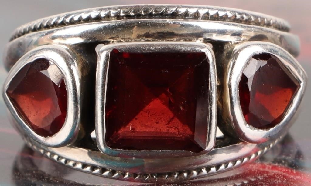 STERLING SILVER LADIES RING WITH DEEP RED GARNET: Sterling silver ladies ring with three deep-red garnet gemstones. Stone Type: Garnet Weight: 7.74 Size: US 6.75 Condition: Very fine.