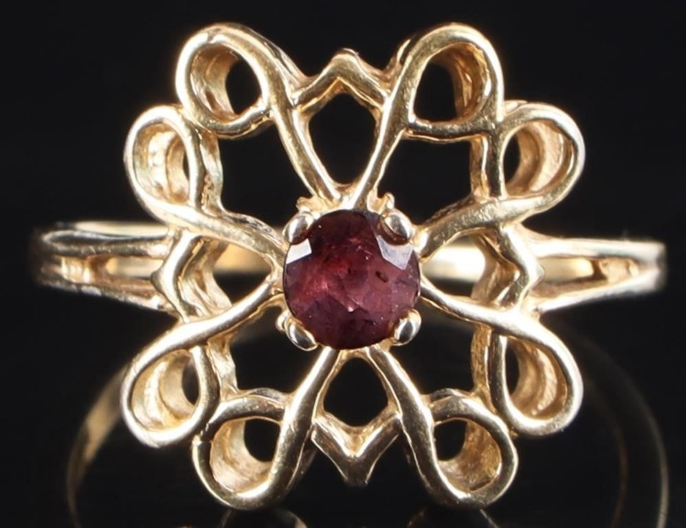 GOLD-TONE STERLING SILVER RING W/ PURPLE SAPPHIRE: Gold-tone sterling silver ladies ring with a 0.25ct round-cut purple sapphire surrounded by twirling flourishes. Stone Type: Sapphire Weight: 3.22 grams Size: US 7.25 Condition: See pictures.